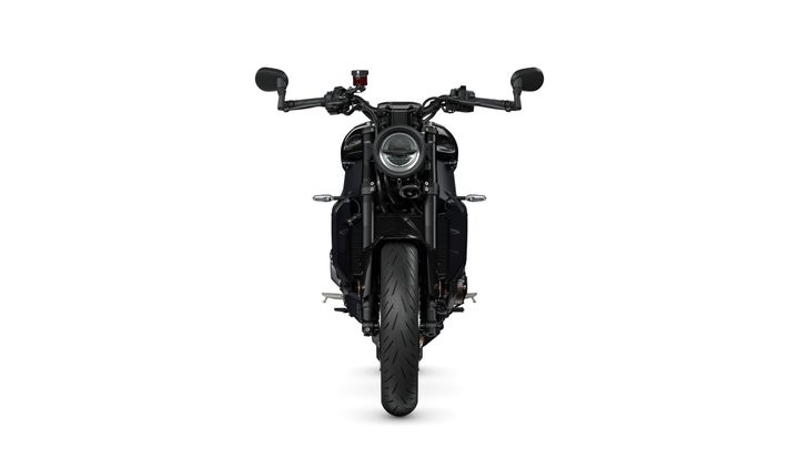 Front view of a modern motorcycle with a round headlight, black handlebars, and a wide tire, set against a white background.