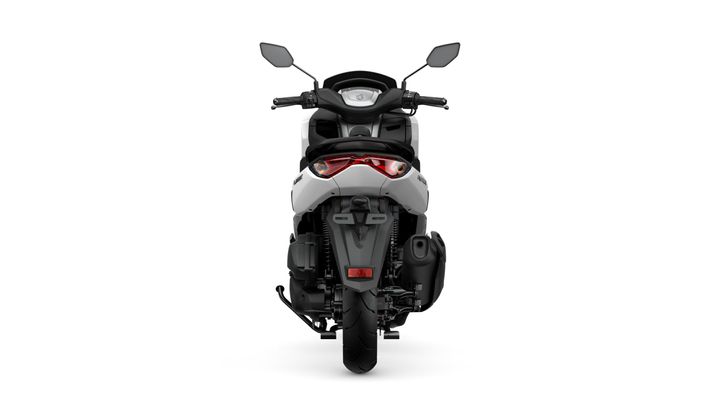 A rear view of a modern scooter with a sleek design, featuring a stylish tail light, handlebars, and a single rear tire on a white background.