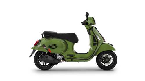 A green scooter with a sleek design, featuring a comfortable black seat and distinctive silver accents, is positioned against a white background.