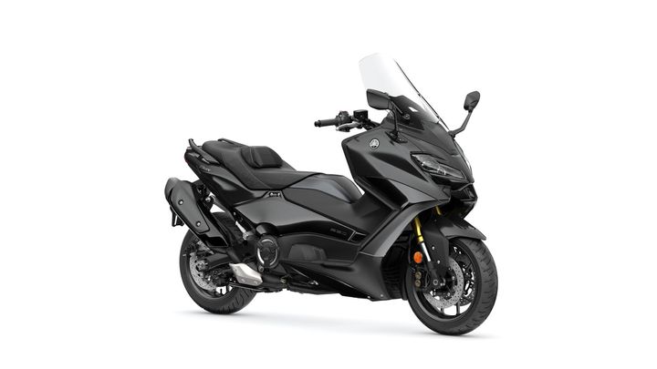 Yamaha 2024 TMAX Tech MAX A sleek black scooter with a streamlined design, featuring a windshield, comfortable seat, and modern handlebars, set against a white background.