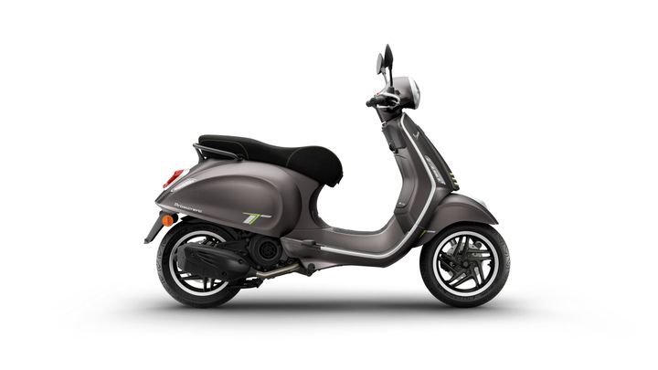A modern gray scooter with a black seat, featuring green accents and a sleek design, is displayed against a white background.