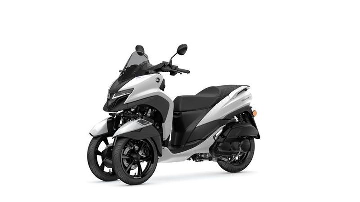 A sleek, silver three-wheeled scooter with a sporty design, featuring a black seat and modern touches, positioned against a plain white background.