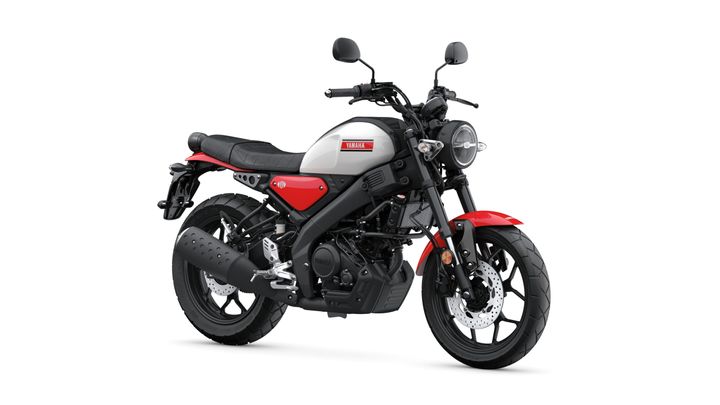 Yamaha 2025 XSR 125 A red and gray Yamaha motorcycle with a sleek design, featuring a round headlight, black seat, and modern minimalist styling, positioned against a white background.