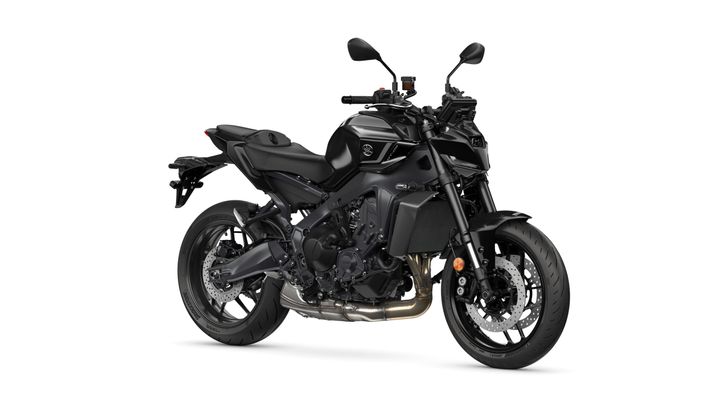 Yamaha 2025 MT-09-Y-AMT A sleek, black motorcycle with a modern design, featuring a prominent frame, sporty seat, high handlebars, and dual disc brakes on the front wheel.