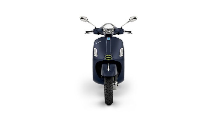 A stylish navy blue scooter with a sleek design, front view, featuring chrome mirrors and modern headlights.