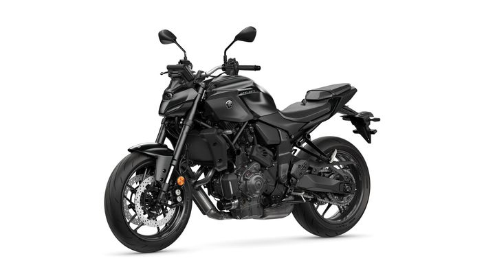 A sleek, black Yamaha MT-07 motorcycle is displayed in a studio setting, showcasing its sporty design, dual headlights, and modern aesthetic.