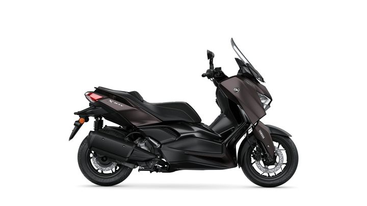 A sleek black Yamaha XMAX scooter displayed from the side, showcasing its aerodynamic design and modern features.