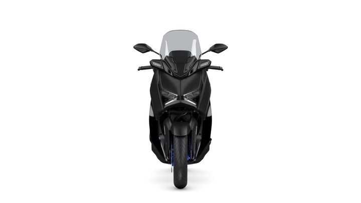 Front view of a sleek, black motorcycle with a windshield and prominent headlights, set against a white background.