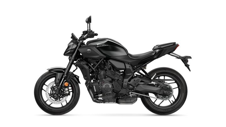 A black Yamaha MT-07 motorcycle, showcasing a sleek design with a prominent engine and modern features, positioned at a slight angle against a white background.