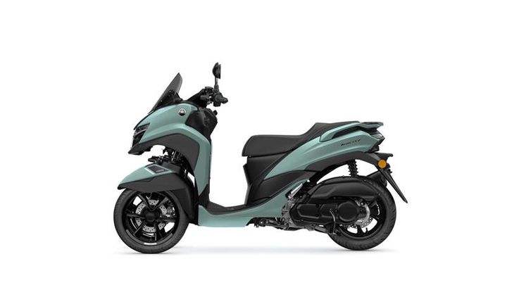 A stylish turquoise and black scooter with a sleek design, side view.