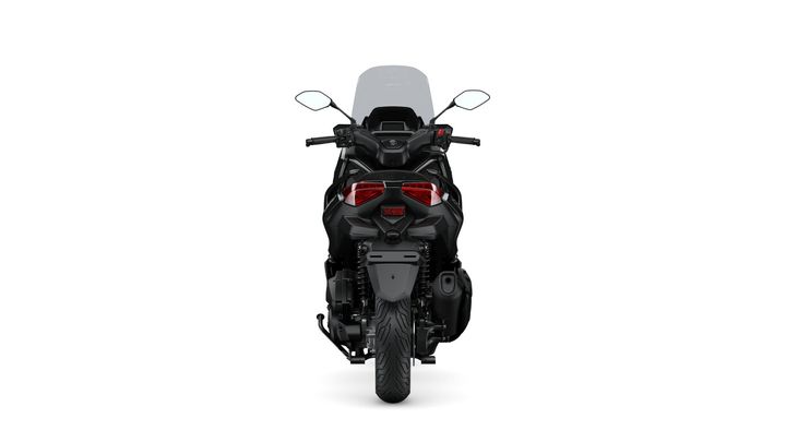A sleek black motorcycle viewed from the rear, featuring prominent tail lights and a clear windshield, set against a white background.