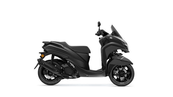A sleek, matte black scooter is displayed in profile, showcasing its modern design, dual headlights, and sporty wheels.