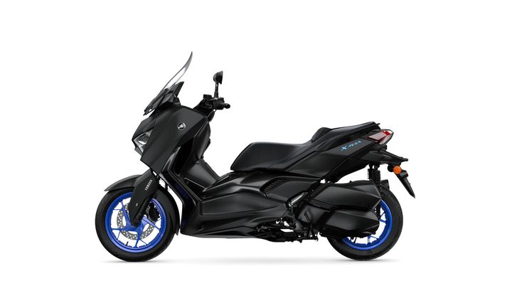 A sleek black Yamaha XMAX scooter with blue accents, displayed from the side to highlight its modern design and features.