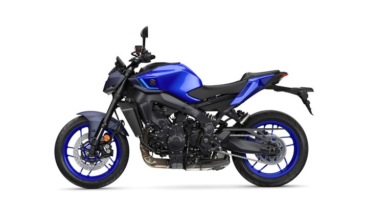 A sleek blue Yamaha motorcycle is displayed from the side, showcasing its modern design and sporty features, including distinct blue wheels and a black seat.