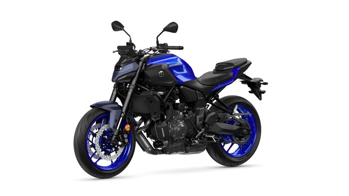 A blue and black modern motorcycle is showcased at an angle, highlighting its sleek design, front wheel, and engine components.
