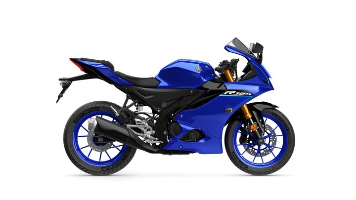 A blue Yamaha R125 motorcycle displayed from the side, featuring a sleek design, sporty fairings, and distinctive blue rims.