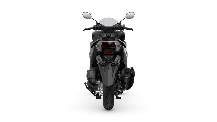 A black motorcycle viewed from the rear, showcasing its sleek design, headlights, and exhaust system against a white background.