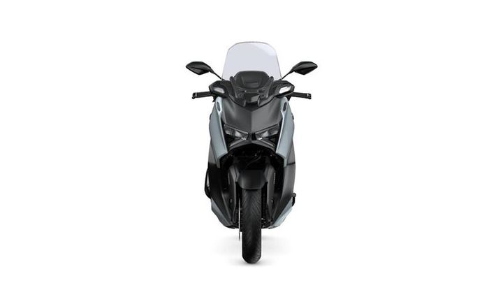 Front view of a sleek, modern scooter with a black and silver design, clear windshield, and prominent headlight features.