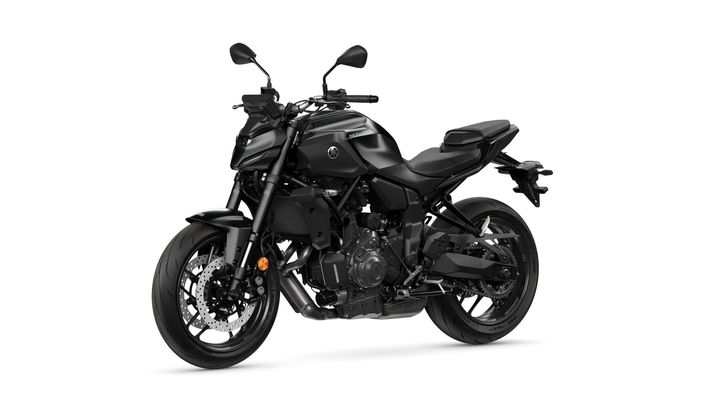 A sleek, all-black motorcycle with a sporty design, featuring a low seat, modern controls, and a muscular engine, positioned against a white background.