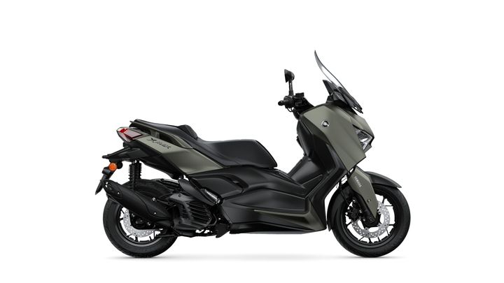 Side view of a black and olive green scooter with a modern design, featuring a sleek body, large windshield, and sporty wheels.