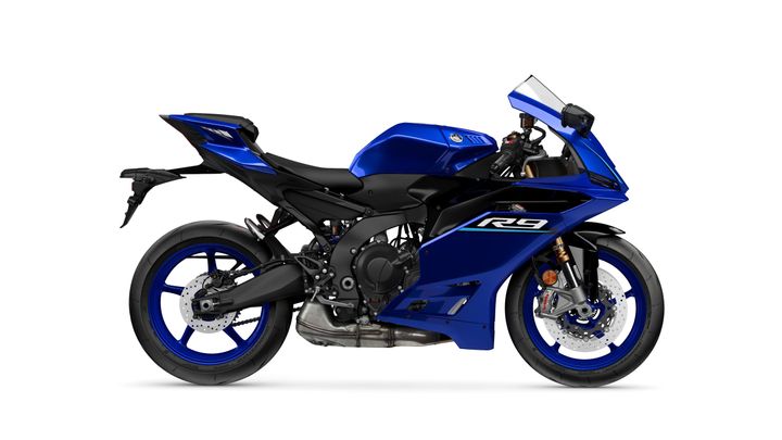 A blue sport motorcycle with a sleek design, featuring a distinctive fairing, sporty seat, and modern aerodynamic elements, displayed against a white background.