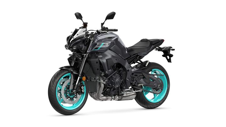 A sleek black motorcycle with turquoise wheels is positioned at an angle, showcasing its sporty design and modern features.