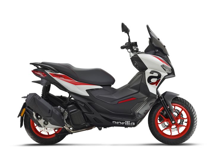 A sleek, modern scooter featuring a black and white body with red accents, showcasing its sporty design and distinctive branding. The vehicle includes a tinted windscreen, a comfortable seat, and stylish alloy wheels.