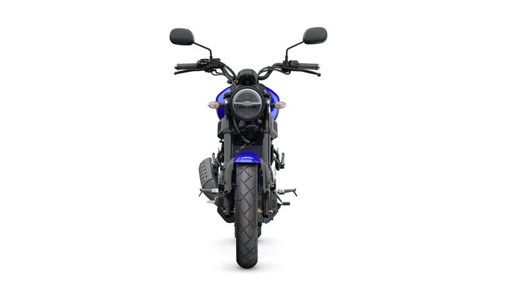 A front view of a blue motorcycle with a round headlight, black handlebars, and a thick tire, set against a white background.