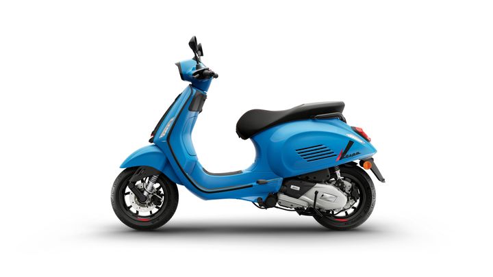 A side view of a vibrant blue scooter with a sleek design, featuring a black seat and chrome details.
