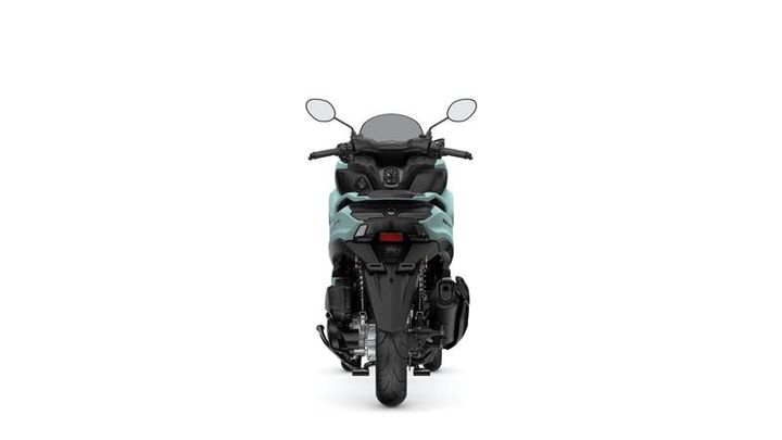 A rear view of a modern motorcycle featuring a sleek design, with a prominent seat, mirrors, and an exhaust on the right side. The color scheme includes a combination of black and teal.