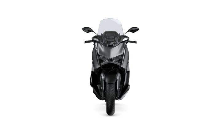 A sleek black motorcycle viewed from the front, featuring a windshield, dual headlights, and handlebars.
