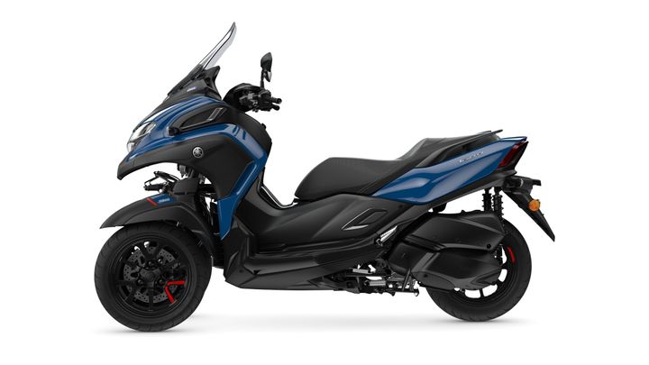 A sleek blue and black Yamaha scooter with a streamlined design, showcasing its front windscreen, comfortable seat, and sporty wheels.