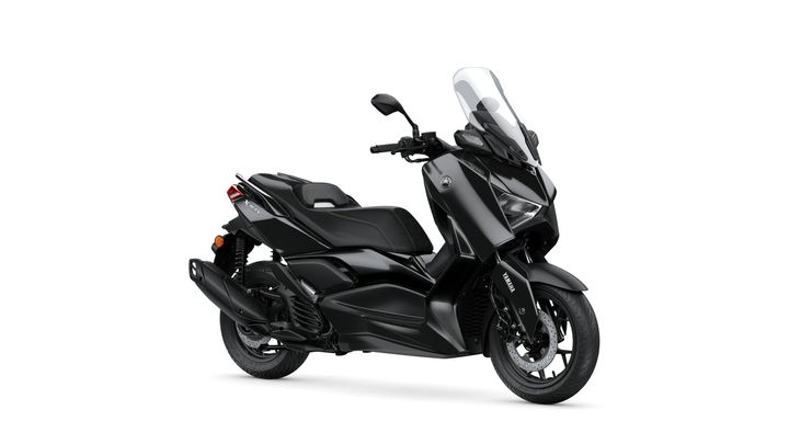 A sleek black Yamaha XMAX scooter, angled to showcase its design, features a small windshield, sporty body lines, and a comfortable seat.