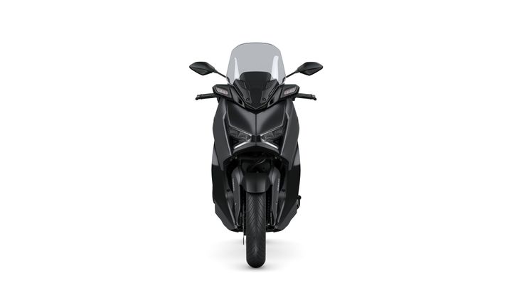 Front view of a sleek black motorcycle, featuring a modern design with angular headlights, a large windshield, and prominent handlebars.