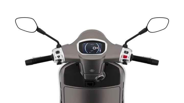 Top view of a scooter's handlebar with digital display, throttle controls, and mirrors on either side.