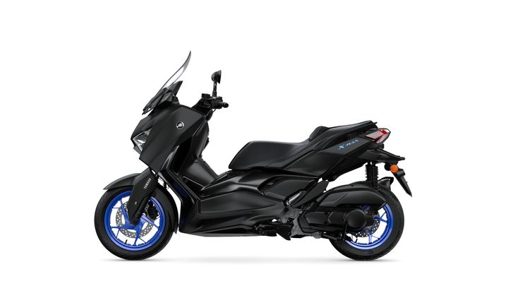 A sleek black Yamaha X-MAX scooter featuring blue wheels, facing right with a clear background.
