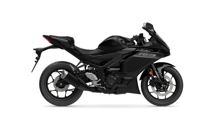 A sleek black motorcycle, the Yamaha YZF-R3, displayed in profile on a white background, showcasing its sporty design and modern features.