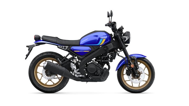 A blue Yamaha motorcycle with a sporty design, featuring a black seat, gold-colored wheels, and modern styling elements, positioned against a white background.