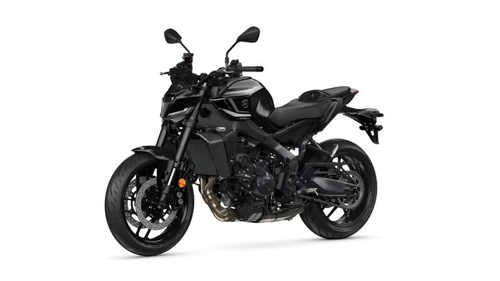 A black motorcycle with a modern design, featuring a sleek chassis, a low seat, and prominent front and rear wheels, displayed at a slight angle.