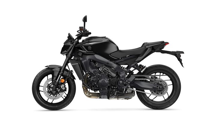 A sleek, black motorcycle with a modern design, featuring sporty lines, a prominent engine, and exposed mechanical components.