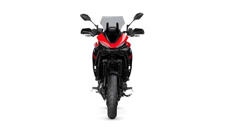 A front view of a modern motorcycle featuring a sleek red and black design, a protective windshield, and LED lights.