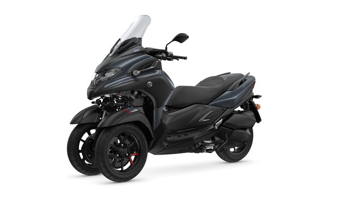 A sleek black two-wheeled scooter with a distinctive front design, including a large windshield and sporty details, positioned on a white background.