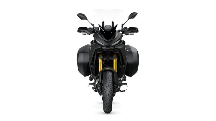 Front view of a black motorcycle with prominent yellow front forks, side panniers, and a tall windscreen.