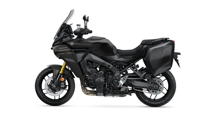 A side view of a black Yamaha motorcycle with a prominent fairing, tall windshield, and a large rear saddlebag, set against a white background.