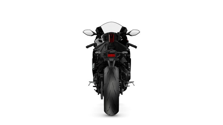 A sleek black motorcycle is shown from the rear, featuring a large rear tire, dual exhaust pipes, and a tinted windscreen. The handlebars and rear lights are visible, set against a plain white background.