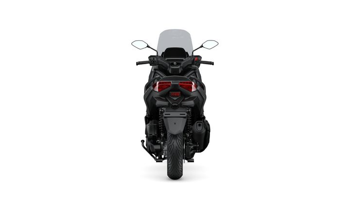 A rear view of a sleek, modern motorcycle, featuring a black body, distinctive taillights, and a visible rear tire on a white background.