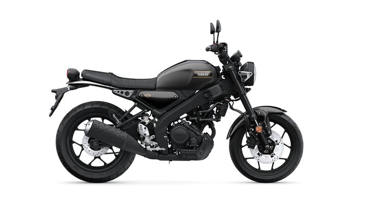 A sleek black motorcycle with a minimalist design, featuring a low seat, round headlight, and dual exhaust, positioned against a white background.