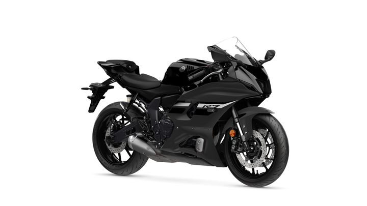 Yamaha 2024 R7 A sleek black motorcycle with a modern design, featuring sporty fairings, a prominent front fairing, and dual exhaust pipes, positioned at an angle against a white background.