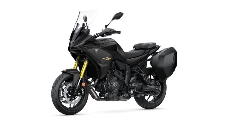 A sleek, black Yamaha Tracer 9 GT motorcycle with gold front forks, side panniers, and a windscreen, positioned on a plain white background.