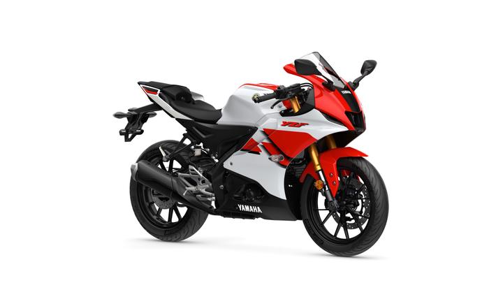 Yamaha 2026 R125 Anniversary Edition A sleek white and red Yamaha motorcycle with a aerodynamic design, showcasing prominent branding and stylish features against a plain white background.